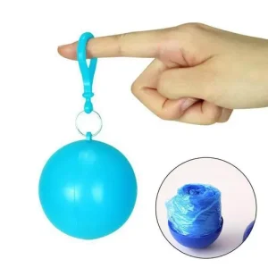 Portable raincoat keychain ball clipped securely to a backpack strap